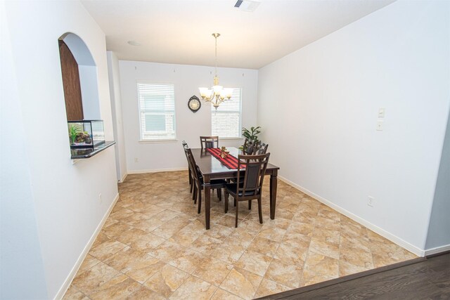 15102 Dry Ridge Ct, Humble, TX 77346 - dining area with a chandelier and baseboards