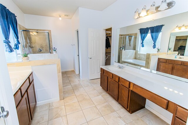 15102 Dry Ridge Ct, Humble, TX 77346 - full bath with a stall shower, a garden tub, two vanities, and a walk in closet