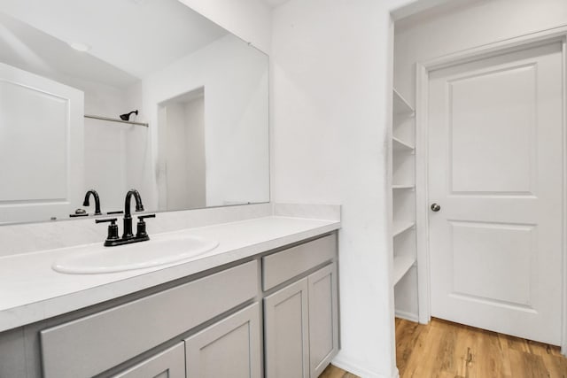4307 Palmetto Grove Ln, Baytown, TX 77521 - full bath with wood finished floors, vanity, and a shower