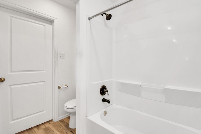4307 Palmetto Grove Ln, Baytown, TX 77521 - bathroom with toilet, shower / bath combination, and wood finished floors