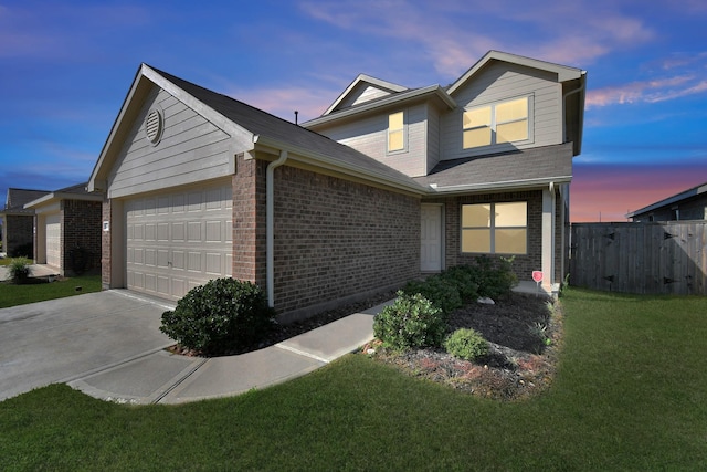 4307 Palmetto Grove Ln, Baytown, TX 77521 - traditional-style home with an attached garage, brick siding, and driveway