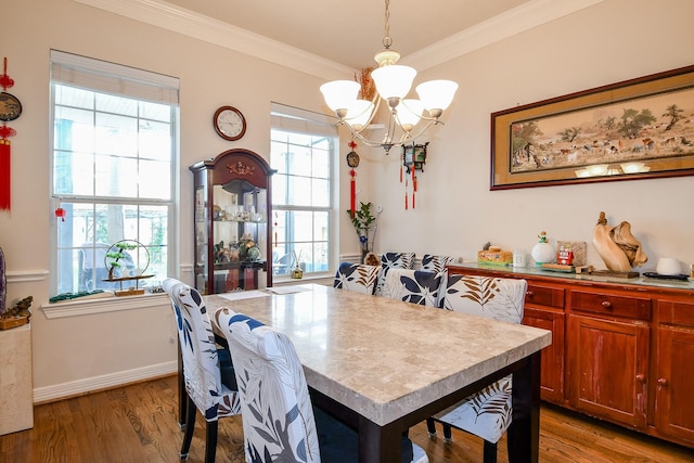 7608 Janak Dr, Houston, TX 77055 - dining area featuring a chandelier, wood finished floors, ornamental molding, and baseboards