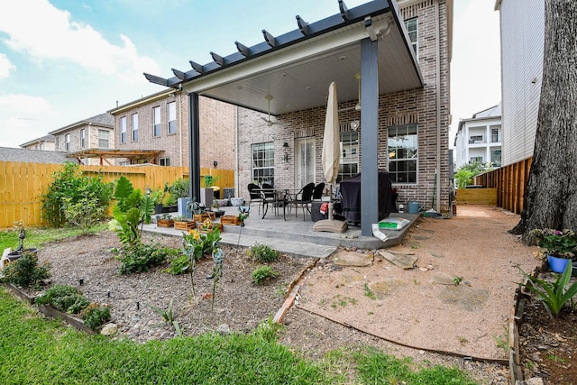 7608 Janak Dr, Houston, TX 77055 - rear view of property with brick siding, a patio, and a fenced backyard