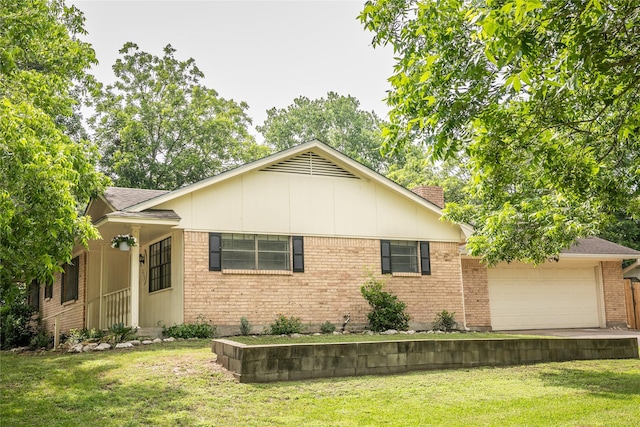 215 Edward Ln, Brenham, TX 77833 - single story home featuring a garage, a front yard, and brick siding