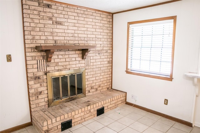 215 Edward Ln, Brenham, TX 77833 - unfurnished living room featuring crown molding, baseboards, and light tile patterned flooring