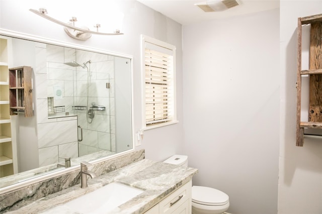 215 Edward Ln, Brenham, TX 77833 - bathroom featuring a stall shower, toilet, and vanity