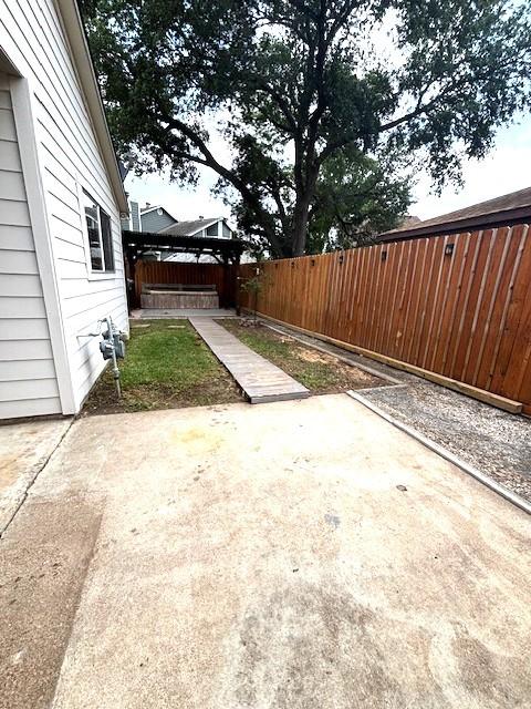 3407 S Briar Knoll Dr, Houston, TX 77082 - fenced backyard featuring a patio area