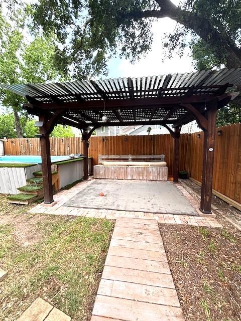 3407 S Briar Knoll Dr, Houston, TX 77082 - fenced backyard with a pergola and a patio area