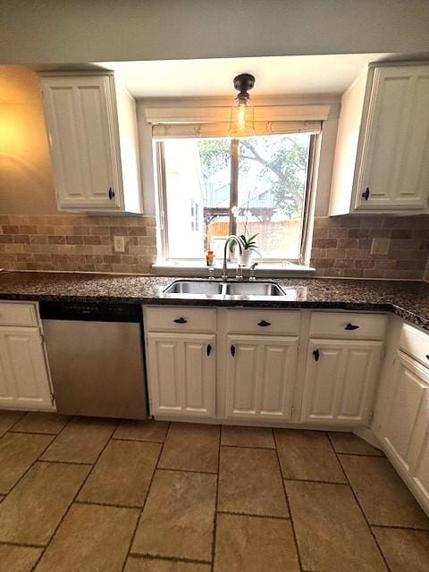 3407 S Briar Knoll Dr, Houston, TX 77082 - kitchen with stainless steel dishwasher, a sink, decorative backsplash, and white cabinets