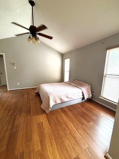 3407 S Briar Knoll Dr, Houston, TX 77082 - bedroom featuring lofted ceiling, wood finished floors, and a ceiling fan
