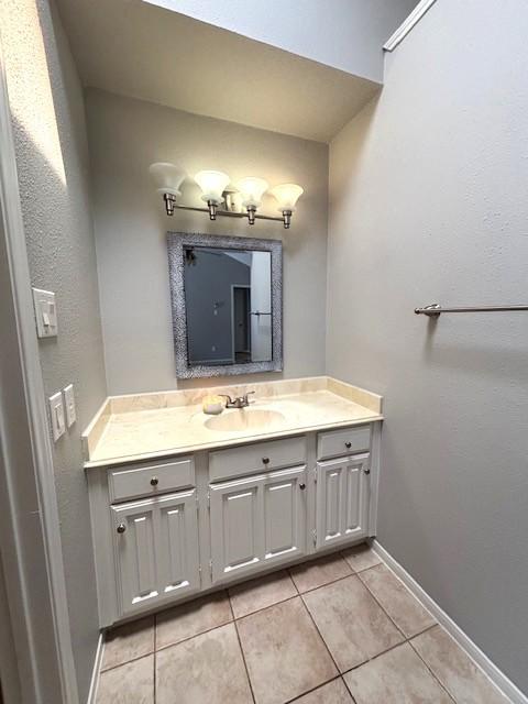 3407 S Briar Knoll Dr, Houston, TX 77082 - bathroom with tile patterned floors, vanity, and baseboards