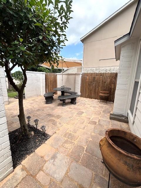3407 S Briar Knoll Dr, Houston, TX 77082 - fenced backyard featuring a patio