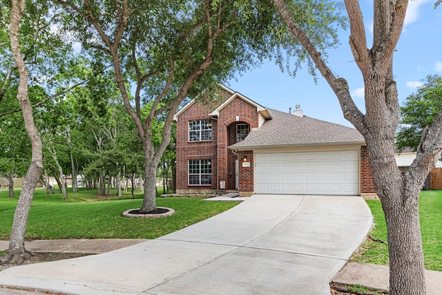 13617 Jasmine Creek Ln, Rosharon, TX 77583 - traditional home with brick siding, driveway, a front lawn, a garage, and roof with shingles