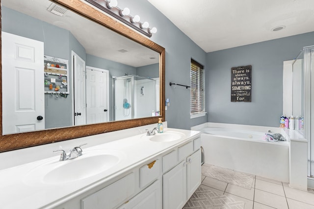 13617 Jasmine Creek Ln, Rosharon, TX 77583 - bathroom featuring double vanity, a garden tub, a stall shower, and tile patterned flooring