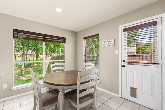 13617 Jasmine Creek Ln, Rosharon, TX 77583 - dining space with light tile patterned floors and baseboards