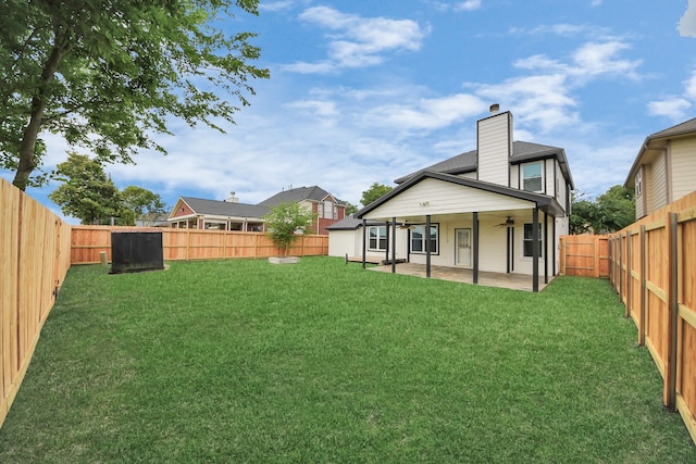 11027 Collingswood Dr, La Porte, TX 77571 - back of property featuring ceiling fan, a chimney, and a patio area