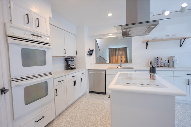 13215 Ravensway Dr, Cypress, TX 77429 - kitchen with stainless steel dishwasher, white double oven, white cabinetry, a center island, and a sink