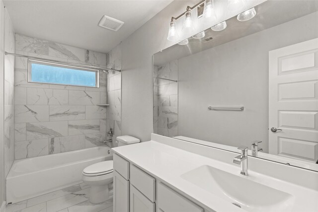 231 Upland Dr, Waller, TX 77484 - full bath featuring marble look tiles, toilet, vanity, and shower / washtub combination