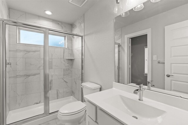 231 Upland Dr, Waller, TX 77484 - full bath with a shower stall, toilet, vanity, recessed lighting, and marble finish flooring