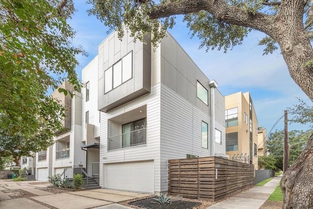 4812 Chenevert St Unit A, Houston, TX 77004 - view of building exterior featuring an attached garage and driveway