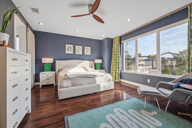 4812 Chenevert St Unit A, Houston, TX 77004 - bedroom featuring a barn door, hardwood / wood-style flooring, baseboards, recessed lighting, and a ceiling fan