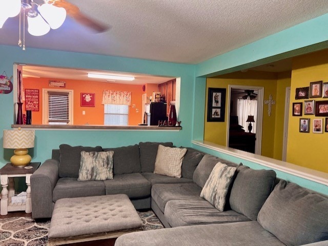 7907 Owl Ln, Baytown, TX 77523 - living room with a ceiling fan and a textured ceiling