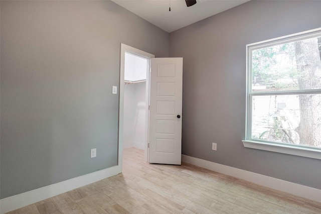 5714 Pershing St A/B, Unit A/B Houston, TX 77033 - unfurnished room with light wood-style floors, ceiling fan, and baseboards