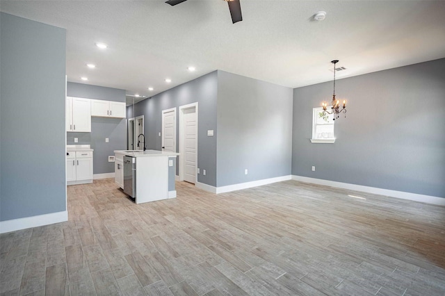 5714 Pershing St A/B, Unit A/B Houston, TX 77033 - kitchen with a chandelier, a ceiling fan, a sink, light wood-style flooring, and recessed lighting