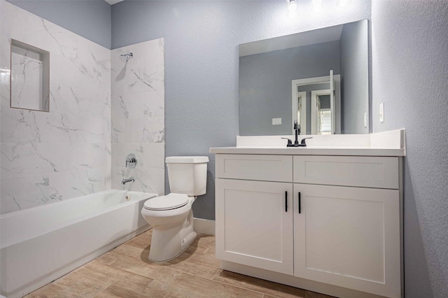 5714 Pershing St A/B, Unit A/B Houston, TX 77033 - bathroom with toilet, wood finished floors, vanity, a textured wall, and shower / bath combination