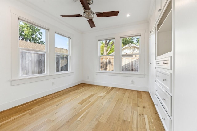 507 W 12th St, Houston, TX 77008 - unfurnished bedroom featuring light wood finished floors, baseboards, crown molding, recessed lighting, and a ceiling fan