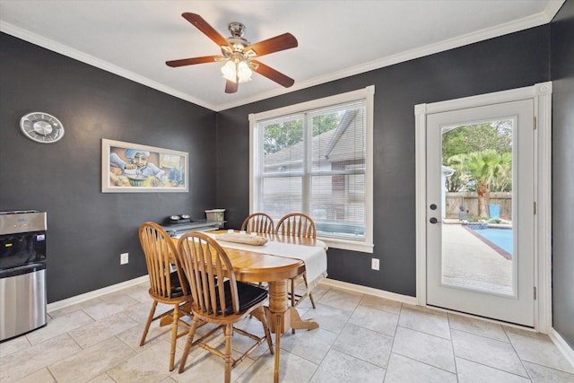 2326 Pin Hook Ct, Seabrook, TX 77586 - dining area with baseboards, ornamental molding, a ceiling fan, and light tile patterned flooring