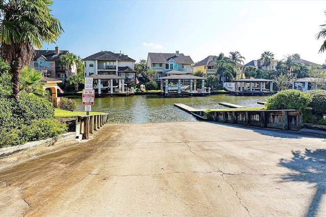 2326 Pin Hook Ct, Seabrook, TX 77586 - dock area with a boat ramp, a residential view, and a water view
