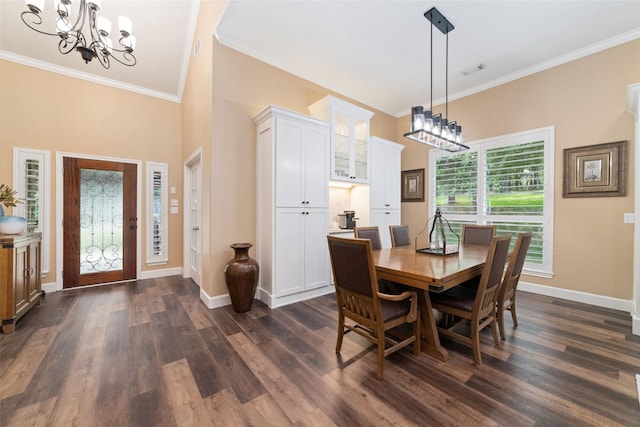 2260 Teas Crossing Dr, Conroe, TX 77304 - dining space featuring a chandelier, crown molding, dark wood-style flooring, and baseboards