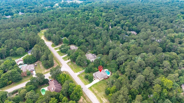 2260 Teas Crossing Dr, Conroe, TX 77304 - aerial overview of property's location with a heavily wooded area