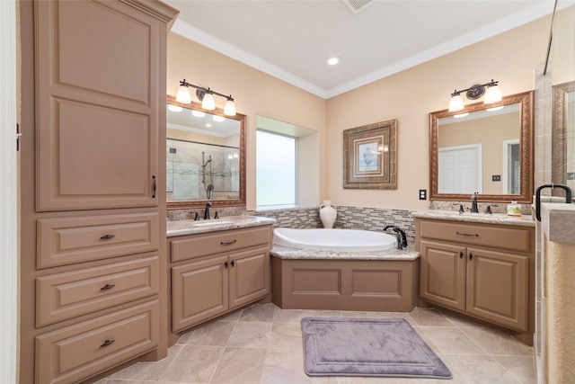 2260 Teas Crossing Dr, Conroe, TX 77304 - full bath with crown molding, a shower stall, a garden tub, and two vanities