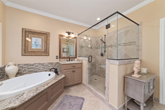 2260 Teas Crossing Dr, Conroe, TX 77304 - bathroom with ornamental molding, a stall shower, a garden tub, vanity, and tile patterned flooring