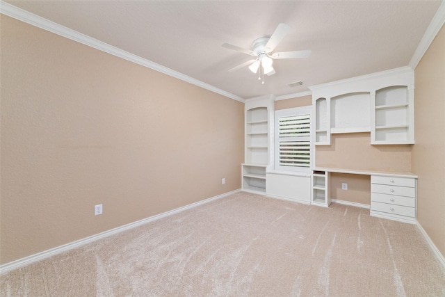 2260 Teas Crossing Dr, Conroe, TX 77304 - unfurnished office with light colored carpet, ceiling fan, built in study area, crown molding, and baseboards