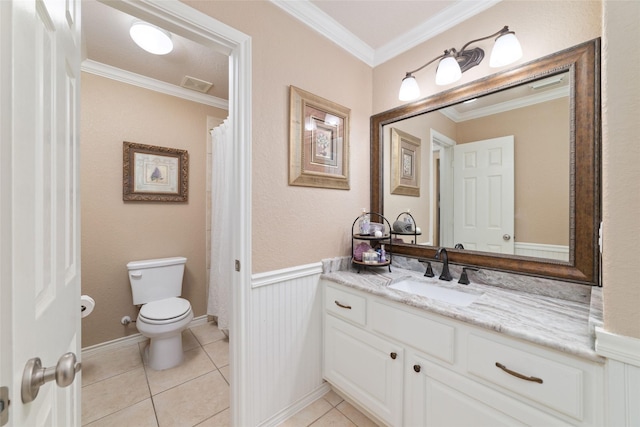 2260 Teas Crossing Dr, Conroe, TX 77304 - bathroom featuring toilet, crown molding, a wainscoted wall, tile patterned floors, and vanity