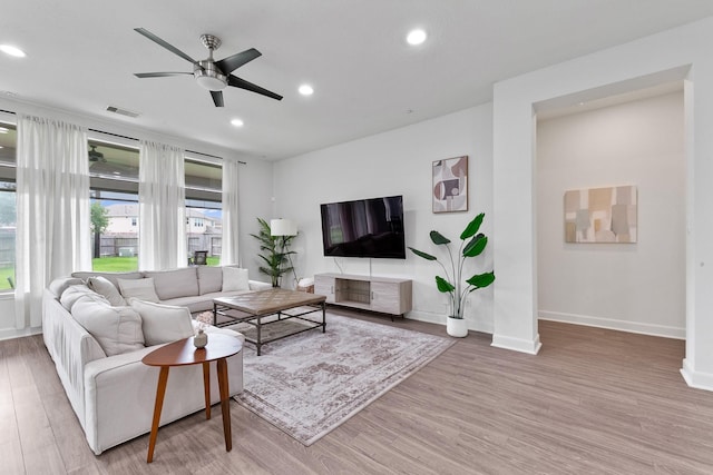 25219 Easton Ramsey Way, Richmond, TX 77406 - living room featuring wood finished floors, a ceiling fan, baseboards, and recessed lighting