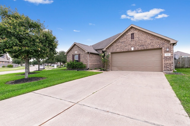 25219 Easton Ramsey Way, Richmond, TX 77406 - single story home featuring brick siding, a front yard, driveway, and a garage