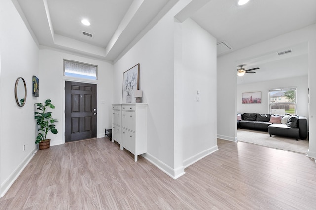 25219 Easton Ramsey Way, Richmond, TX 77406 - entryway with light wood-style flooring, baseboards, and a ceiling fan