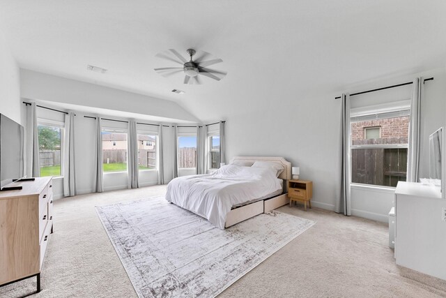 25219 Easton Ramsey Way, Richmond, TX 77406 - bedroom featuring light colored carpet, vaulted ceiling, and a ceiling fan