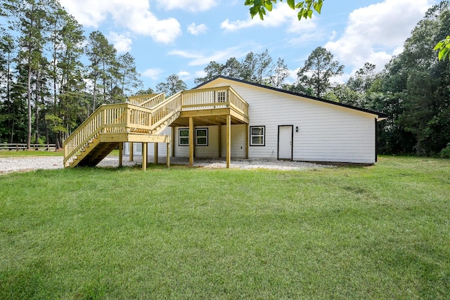527 Fm 787th Rd E, Cleveland, TX 77327 - back of property with stairway, a deck, and a yard