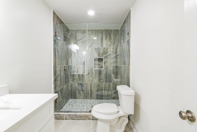 527 Fm 787th Rd E, Cleveland, TX 77327 - bathroom with toilet, vanity, a stall shower, and baseboards