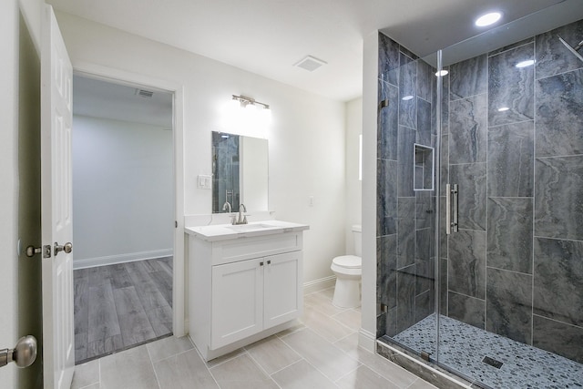 527 Fm 787th Rd E, Cleveland, TX 77327 - full bath with toilet, vanity, a shower stall, baseboards, and recessed lighting