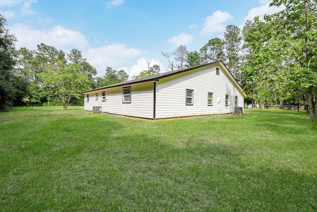 527 Fm 787th Rd E, Cleveland, TX 77327 - view of side of property featuring a yard and cooling unit