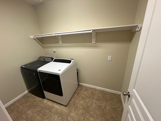 16127 Port O Call St, Crosby, TX 77532 - laundry room with washer and clothes dryer and baseboards