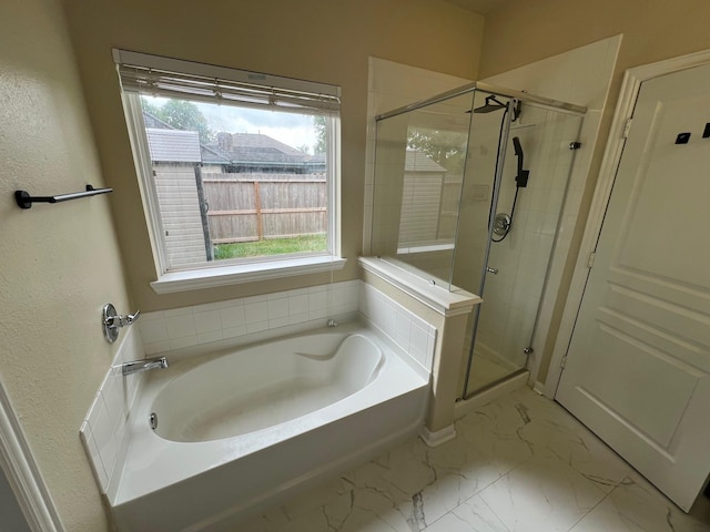 16127 Port O Call St, Crosby, TX 77532 - bathroom with a garden tub, a shower stall, and marble look tiles