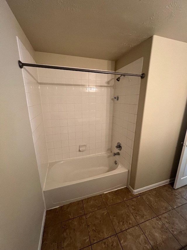 16127 Port O Call St, Crosby, TX 77532 - full bathroom with baseboards, shower / washtub combination, a textured ceiling, and tile patterned flooring