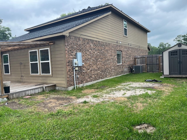 16127 Port O Call St, Crosby, TX 77532 - view of side of property featuring brick siding, central air condition unit, and a deck